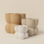 The Caribe Trio nesting planter set in Sand & Stone — white, khaki and natural wood gradient