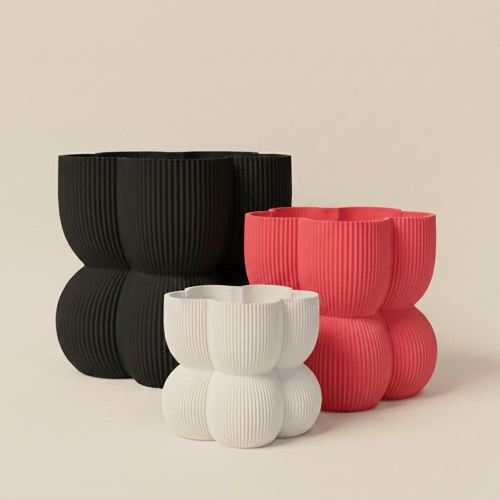 The Caribe Trio nesting planter set in Bold Pop — white, strawberry red and black
