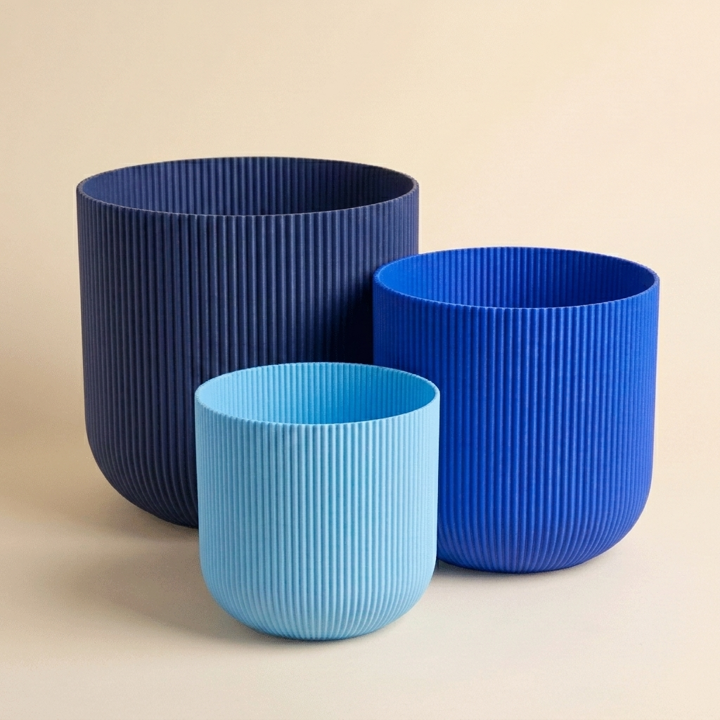 The Forma Trio nesting planter set in Coastal — light blue, blue and navy gradient