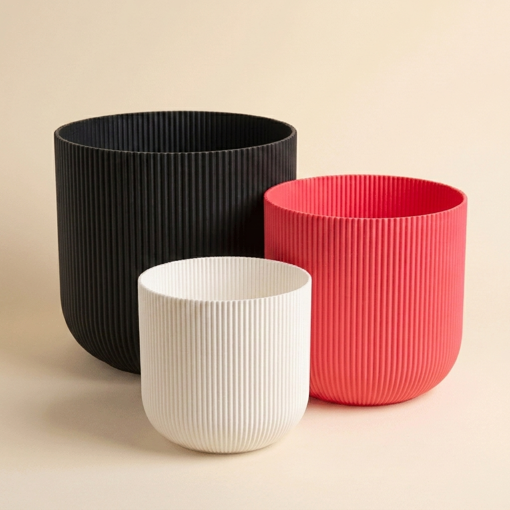 The Forma Trio nesting planter set in Bold Pop — white, strawberry red and black
