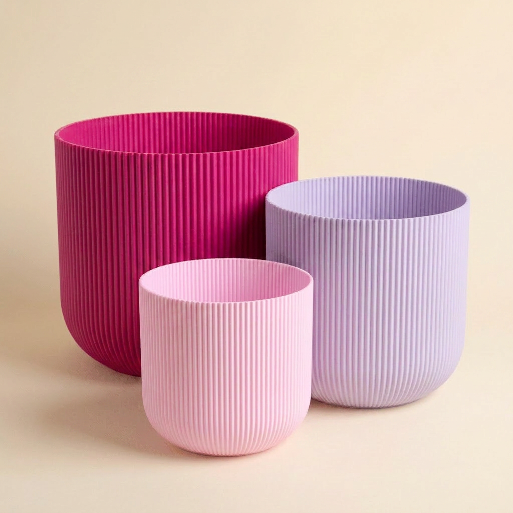 The Forma Trio nesting planter set in Pink Punch — petal pink, lilac and magenta gradient