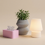 The Reading Nook in Blush Calm — grey planter, petal pink tissue box, glowing lamp