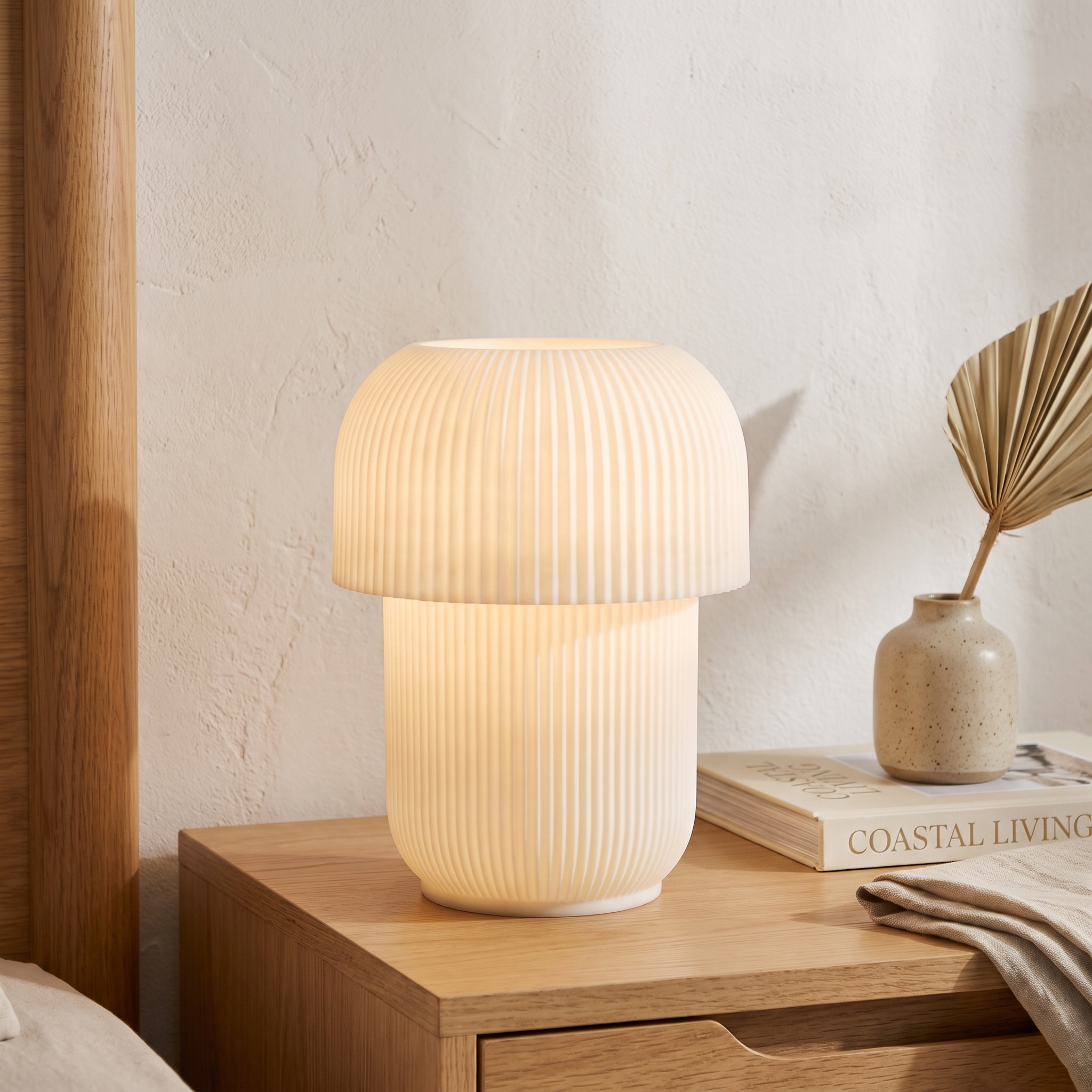 Truco Table Lamp styled on a bedside table, glowing softly