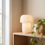 Truco Table Lamp styled on a timber shelf with a plant